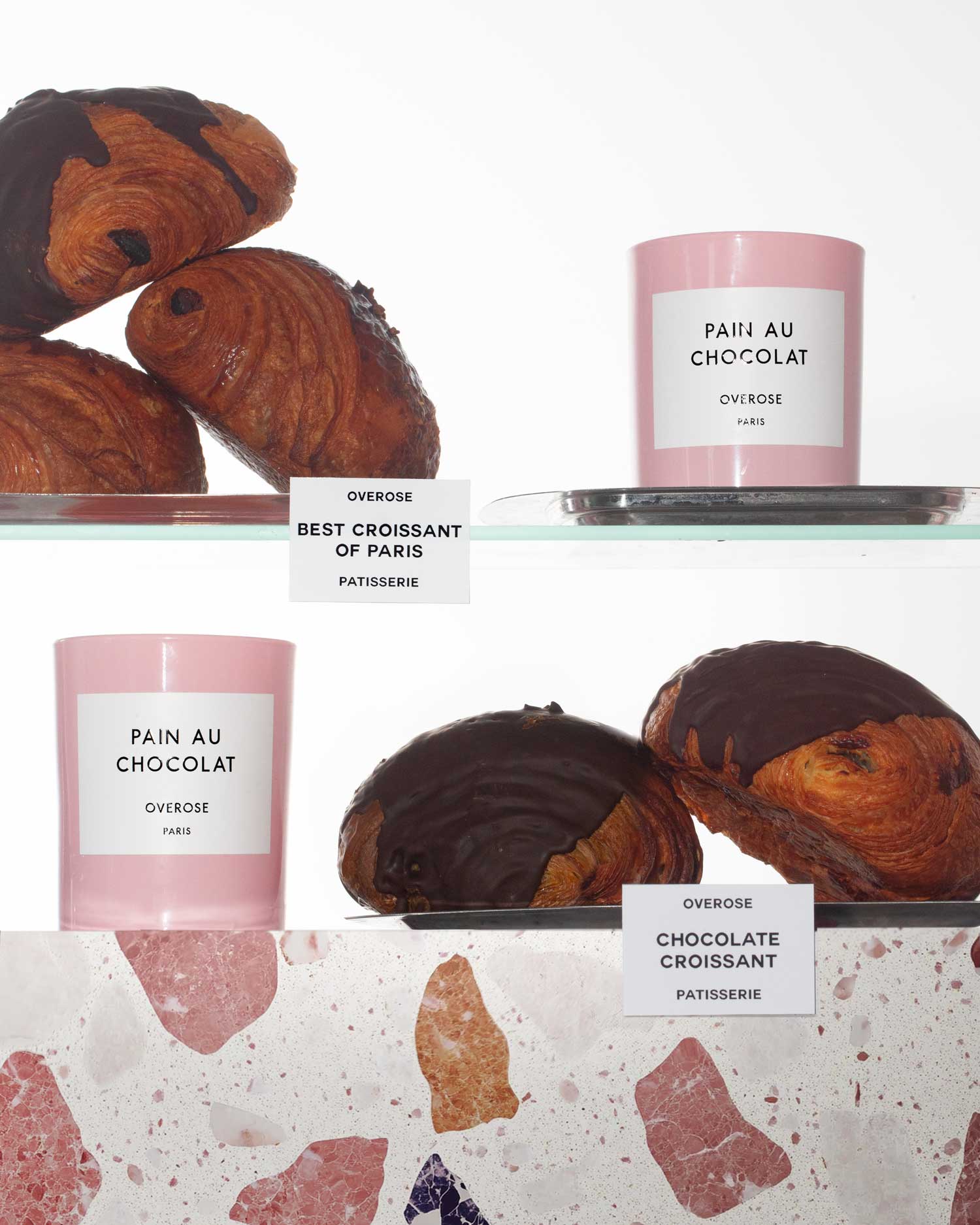 a shelf of "Pain au Chocolate" candles and chocolate Croissants