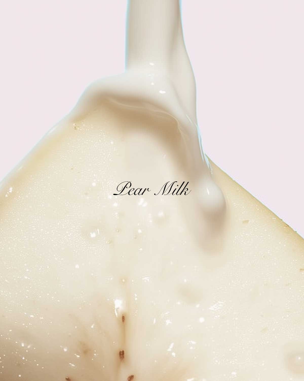 Close-up of a creamy texture with 'Pear Milk' text on a light pink background