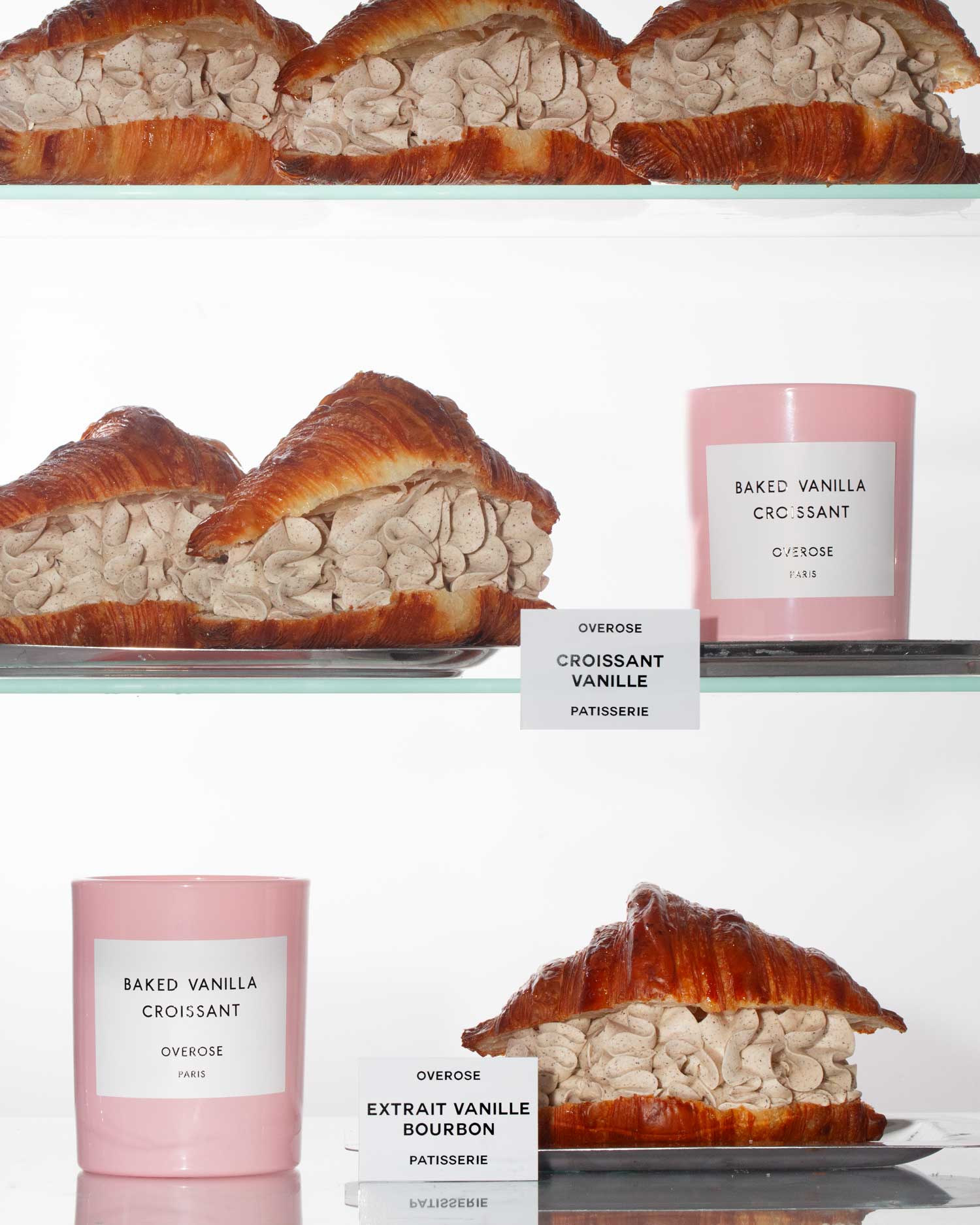 A shelf with 'Baked Vanilla Croissant' candles and vanilla croissant pastries