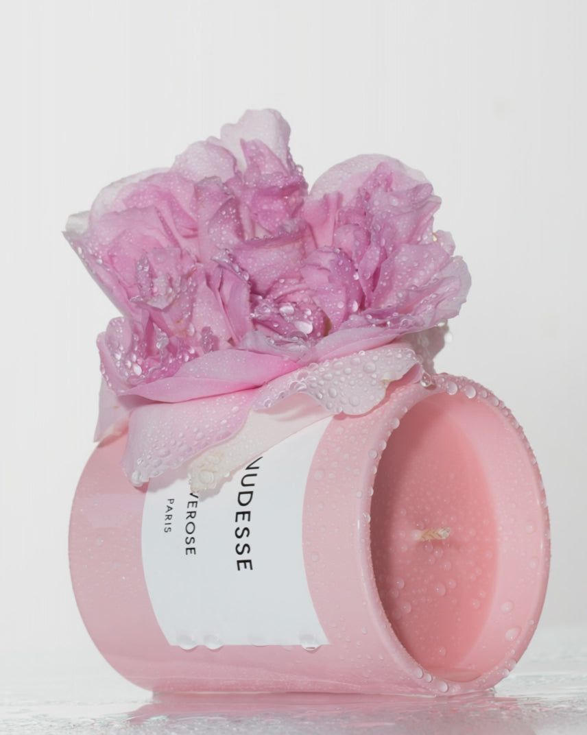 water dropping on rose on top of a 'Nudesse' candle