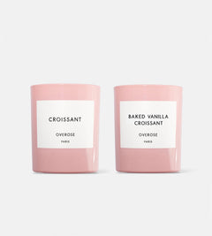 Two pink candles, one labeled 'Croissant' and the other labeled 'Baked Vanilla Croissant'.