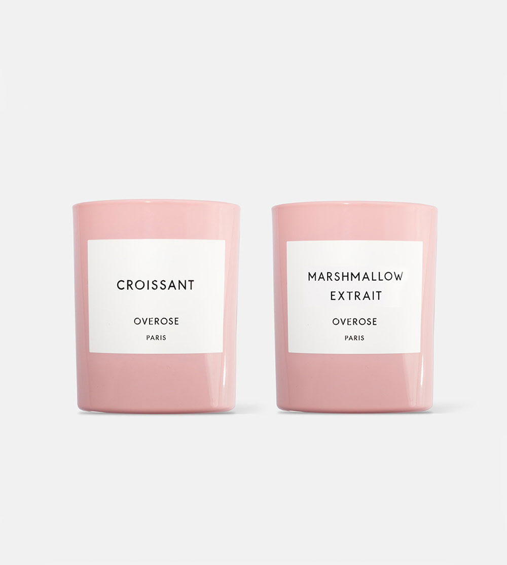 Two pink candles, one labeled 'Croissant' and the other 'Marshmallow Extrait'.