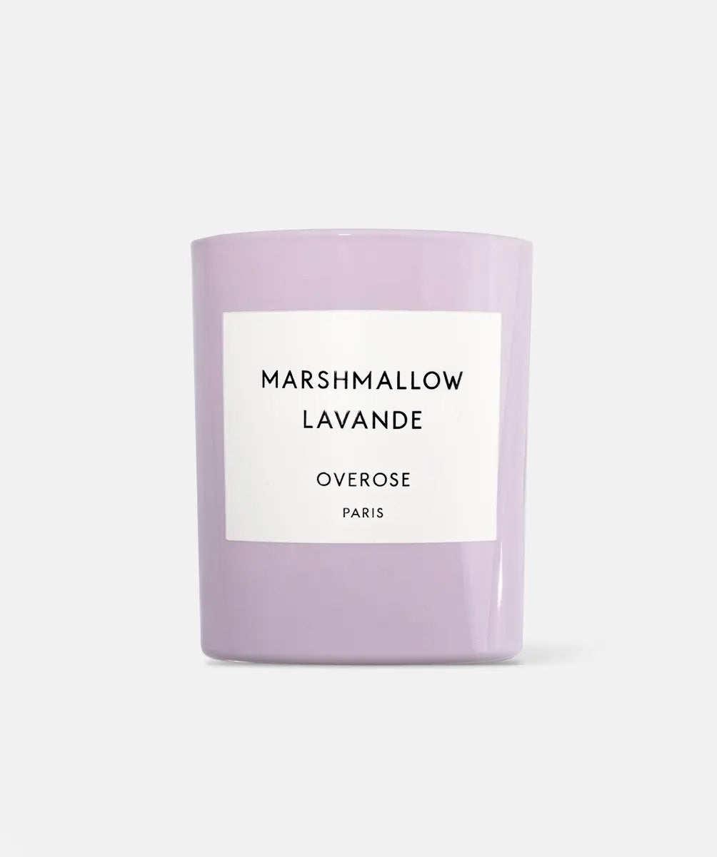 A lavender-colored glass jar candle with a white rectangular label reading 'MARSHMALLOW LAVANDE OVEROSE PARIS' on a light gray background.