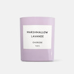 A lavender-colored glass jar candle with a white rectangular label reading 'MARSHMALLOW LAVANDE OVEROSE PARIS' on a light gray background.