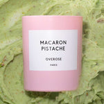 Macaron Pistachio labeled candles in front of pistachio cream background