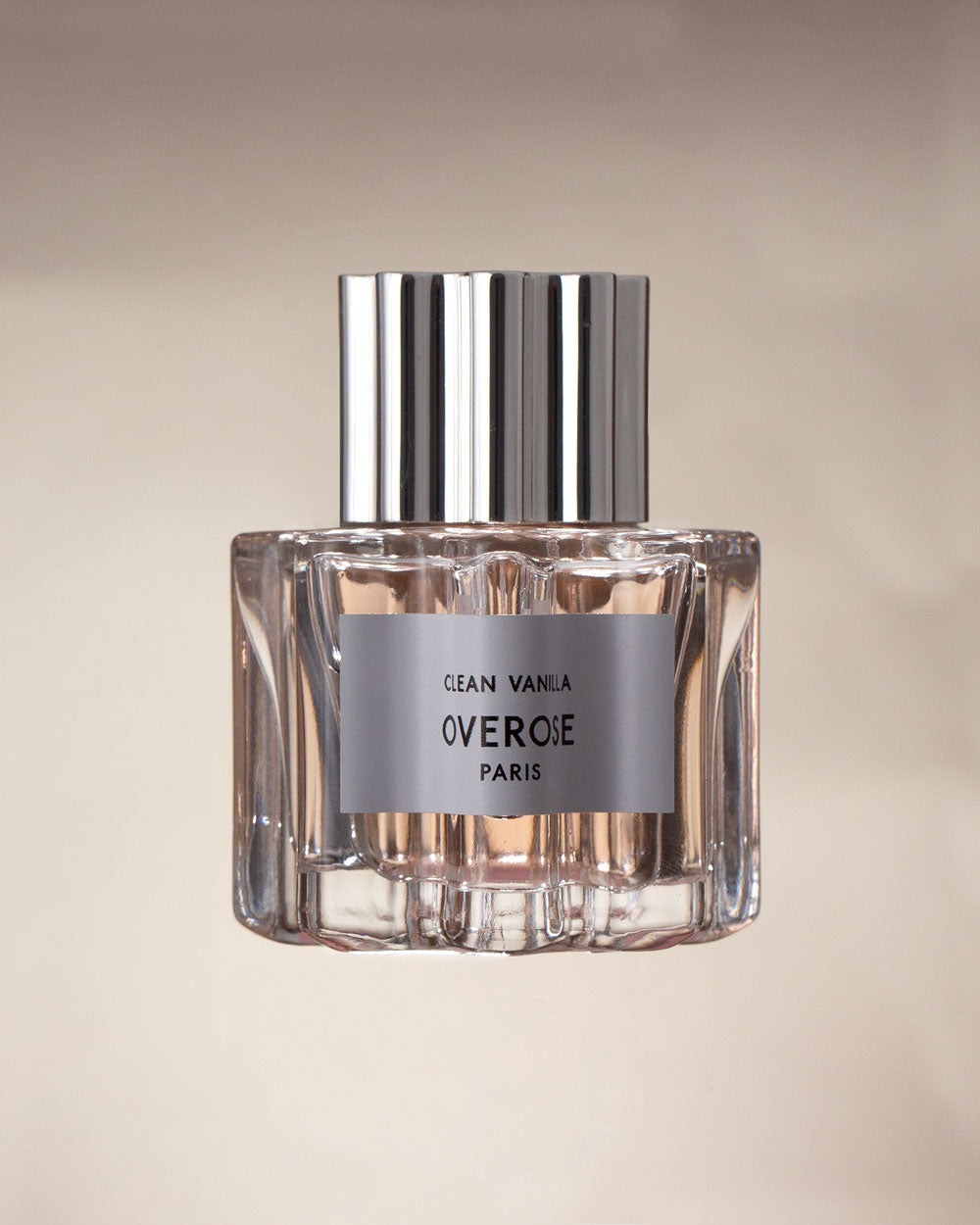 Perfume bottle labeled 'Clean Vanilla' by Overose Paris on a beige background