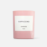 A pink candle labeled 'Cappuccino' by Overose Paris.