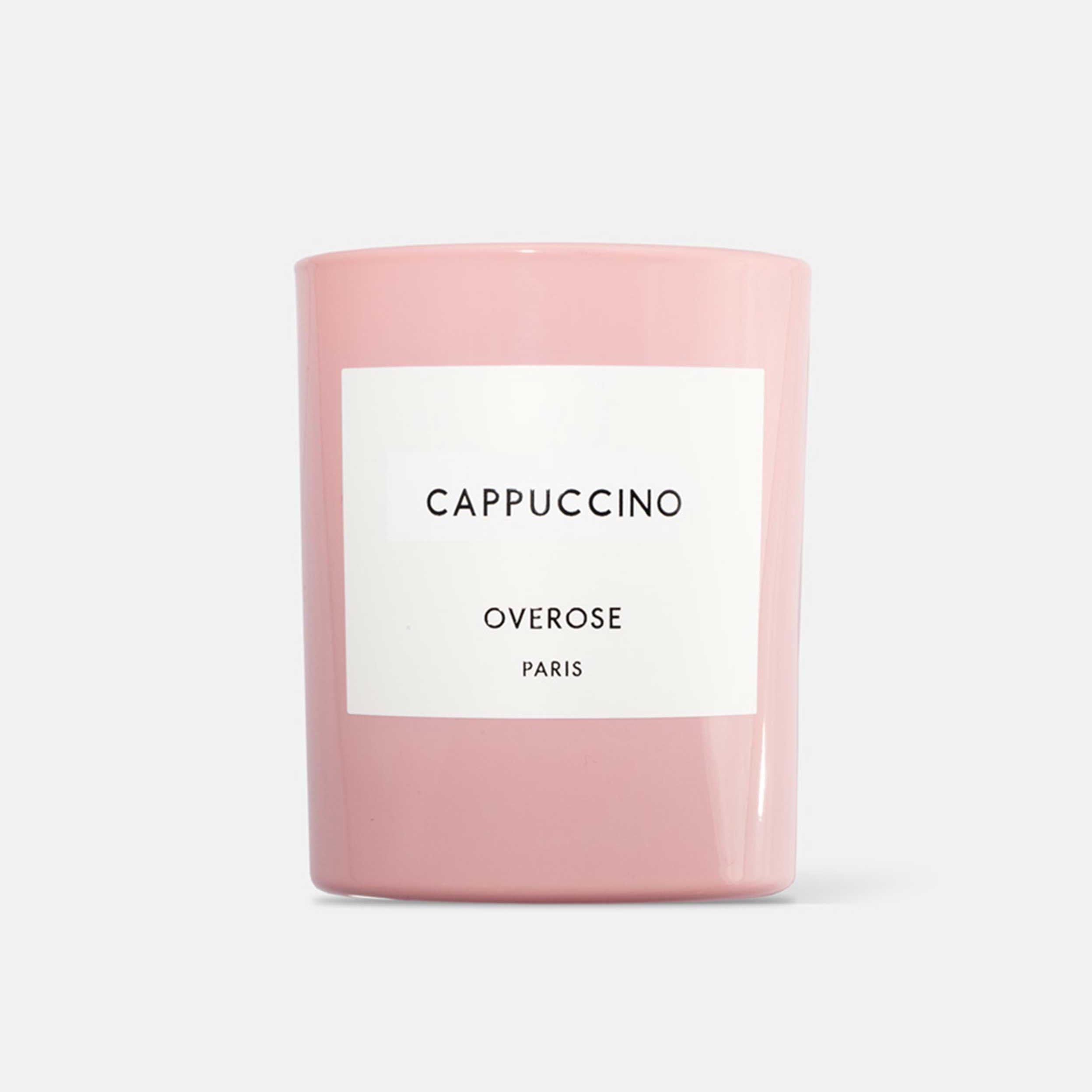 A pink candle labeled 'Cappuccino' by Overose Paris.