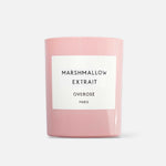 A pink scented candle with the label 'MARSHMALLOW EXTRAIT' on the front.