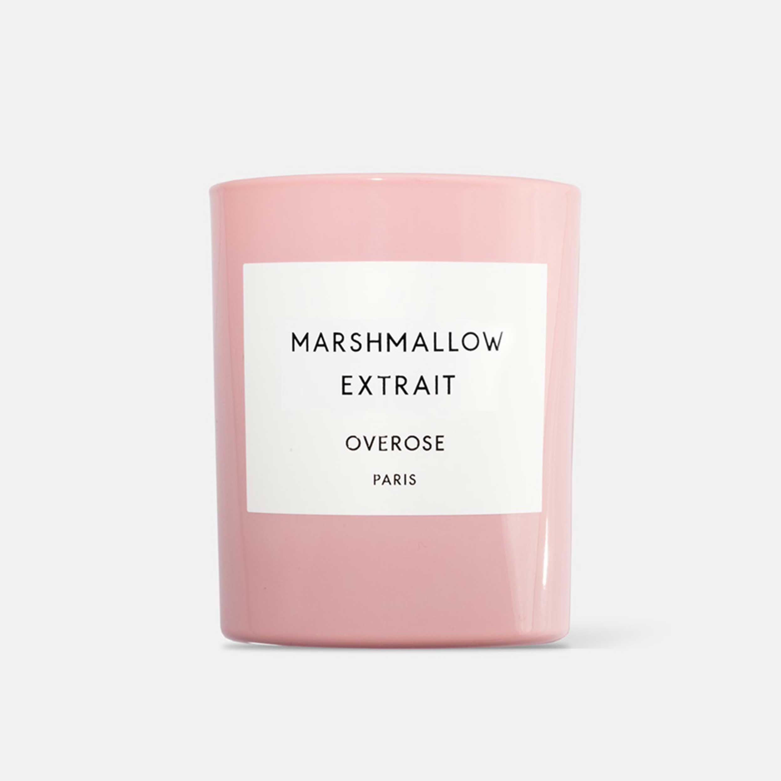 A pink scented candle with the label 'MARSHMALLOW EXTRAIT' on the front.