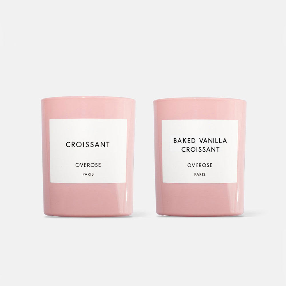 Two pink candles, one labeled 'Croissant' and the other labeled 'Baked Vanilla Croissant'.