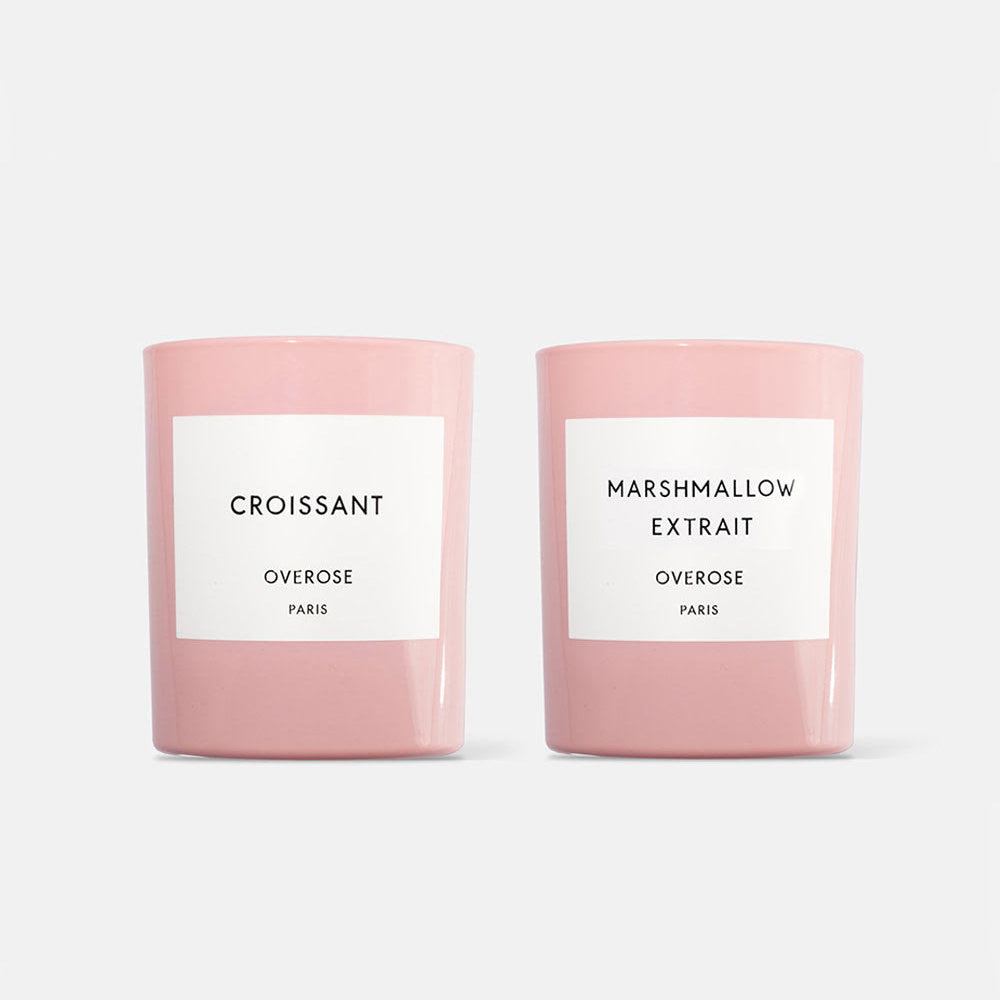 Two pink candles, one labeled 'Croissant' and the other 'Marshmallow Extrait'.