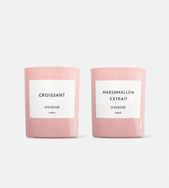 Two pink candles, one labeled 'Croissant' and the other 'Marshmallow Extrait'.